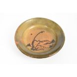Bernard Leach slip-trailed dish with trailed ornament on green ground, monogram and impressed marks,