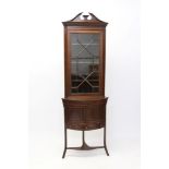 Edwardian mahogany and boxwood line-inlaid standing corner cupboard with broken arch pediment and