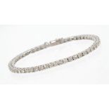 Diamond tennis bracelet with a continuous line of fifty-three brilliant cut diamonds in 18ct white