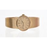 1970s ladies' Omega Genève 9ct gold wristwatch with oval textured gold dial with applied baton
