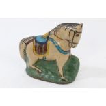 Persian glazed pottery figure of a Qajar horse, with polychrome decoration,