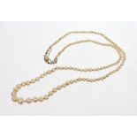 Cultured pearl necklace with a string of graduated cultured pearls on a diamond set clasp