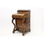 Mid-Victorian walnut piano-top davenport, the rear-rising stationery compartment with brass gallery,