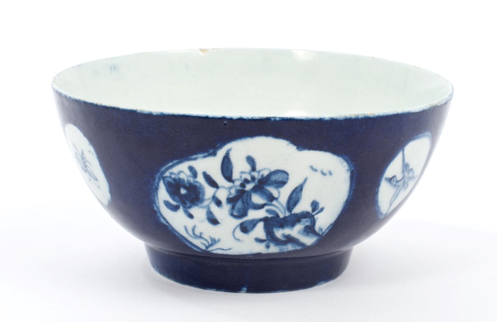 18th century Lowestoft blue and white bowl with chinoiserie figure and floral reserves on