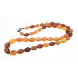 Amber bead necklace with graduated amber beads, length approximately 70cm.