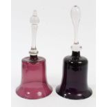 Two Victorian amethyst glass bells with knopped clear glass handles,