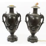 Pair of early 20th century Continental spelter lamp bases of slender urn form,