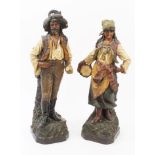Pair late 19th century Austrian pottery figures of peasants,