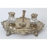Victorian silver desk stand of shaped oval form, with engraved presentation inscription,