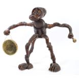 Early 20th Century root carving dinner gong in the form of a baboon, with glass eyes,