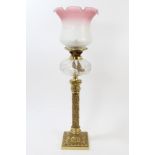 Ornate late 19th century oil lamp with bulbous-form pink etched glass shade and cut glass reservoir,