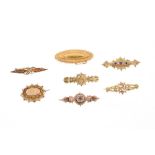 Collection of seven Victorian gold brooches - to include seed pearl and gem set brooches