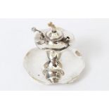 Edwardian silver table lighter and ashtray of shaped circular form,