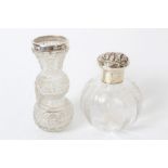 Edwardian cut glass scent bottle of globular form, with panels of foliate decoration,