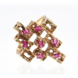 1970s gold dress ring of abstract design, scattered with rubies.