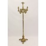 Baroque-style brass floor-standing candelabrum with central knopped column issuing four scrolling