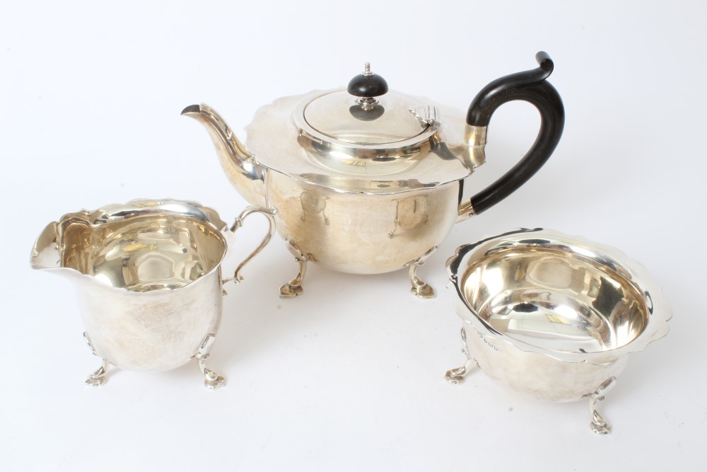 1920s silver three piece tea set - comprising teapot of cauldron form, with flared shaped border,