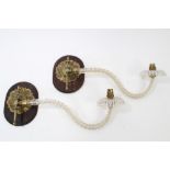 Pair of Edwardian brass and barley-twist glass wall lights, each rosette mount on wooden wall mount,