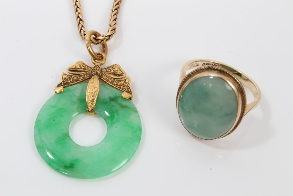 Chinese green jade pendant with gold mounts, on chain,