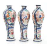 Garniture of three 18th century Chinese export vases with painted Mandarin palette figure reserves