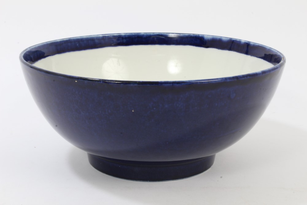 18th century powder-blue punch bowl raised on circular foot,