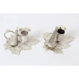 Pair George IV silver miniature chamberstick with vine leaf bases, handles and candle holders,