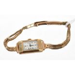 Art Deco ladies' Omega 9ct wristwatch with rectangular dial in 9ct gold tank-shape case by Dennison