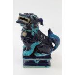 Antique Chinese blue glazed porcelain temple dog, raised on stand with lion mask mounts,