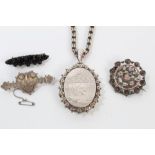 Victorian silver oval locket on chain,