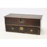 Late 17th century oak bible box, plank lid hinging on pins, with geometric panelled drawer below,