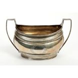 George III silver two-handled sugar bowl of oval form, bright cut borders,