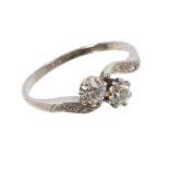 Diamond two stone ring with two old cut diamonds in platinum crossover setting,