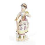 Late 19th century Meissen porcelain figure of a girl holding a spade and posy of flowers,
