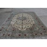 Large Kashan carpet with central petalled medallion issuing scrolling foliate arabesque on cream