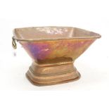18th / 19th century French copper wine cooler of tapering oblong form, on stepped foot,