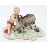 19th century German porcelain figure group of a boy with goat and grapes,