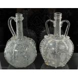 Two 19th century Continental glass bottle-shaped flasks with engraved windmill,