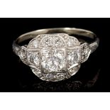 Art Deco diamond ring with a cluster of old brilliant cut diamonds in a stepped setting with