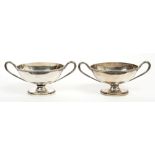 Pair George III silver two-handled dishes of oval form, with engraved armorial crests,