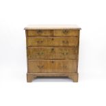 Early 18th century walnut chest of drawers, quarter-veneered top with moulded edge,