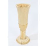 Early German turned ivory cup of slender trumpet form, on plain stem and solid spread foot,