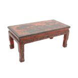 Late 19th / early 20th century Chinese red lacquer low table decorated with phoenixes and foliage,