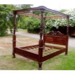 Victorian-style carved hardwood four-poster bed,