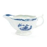 18th century Worcester blue and white sauce boat with moulded and painted chinoiserie landscape