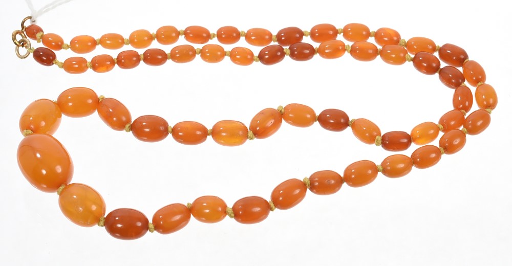 Old amber necklace with a string of graduated butterscotch amber beads measuring 19mm - 6mm,