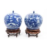 Pair 19th century Chinese baluster-shaped vases and covers with white slip decorated floral