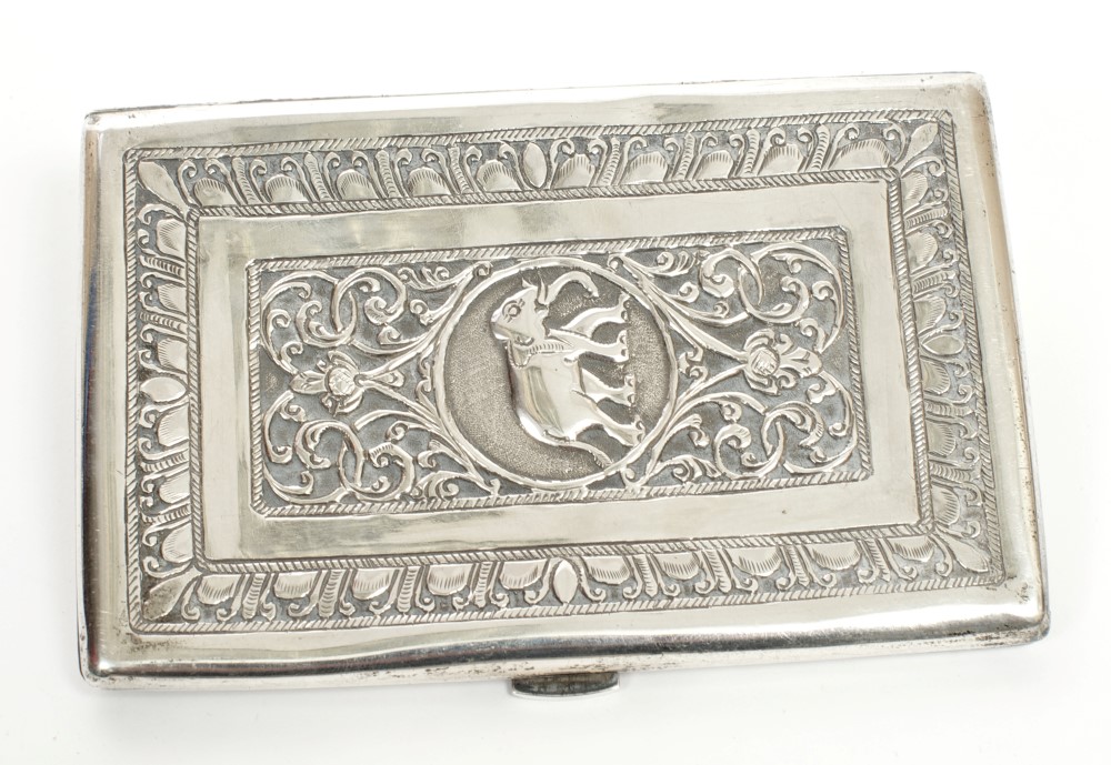 Late 19th / early 20th century Indian white metal cigarette case of rectangular form,