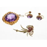 Victorian amethyst brooch with a large oval mixed cut amethyst measuring approximately 24mm x 18mm,