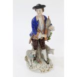 Early 20th century Dresden porcelain figure of a shepherd with bagpipes and sheep, 24.