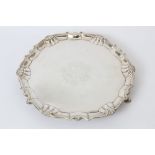 George II silver salver of circular form, with piecrust border and shell and scroll edge,